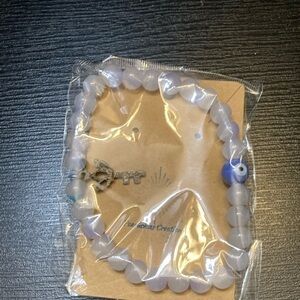 White Beaded Bracelet with Key Charm